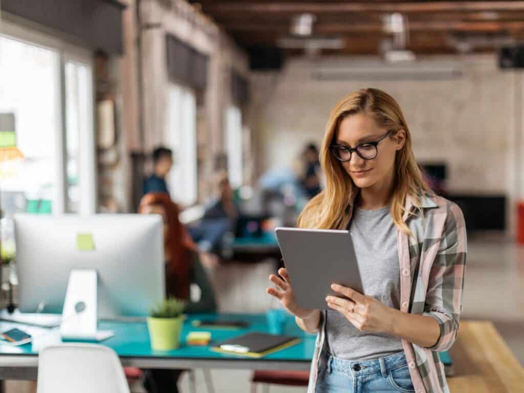 lady holding a tablet in an office